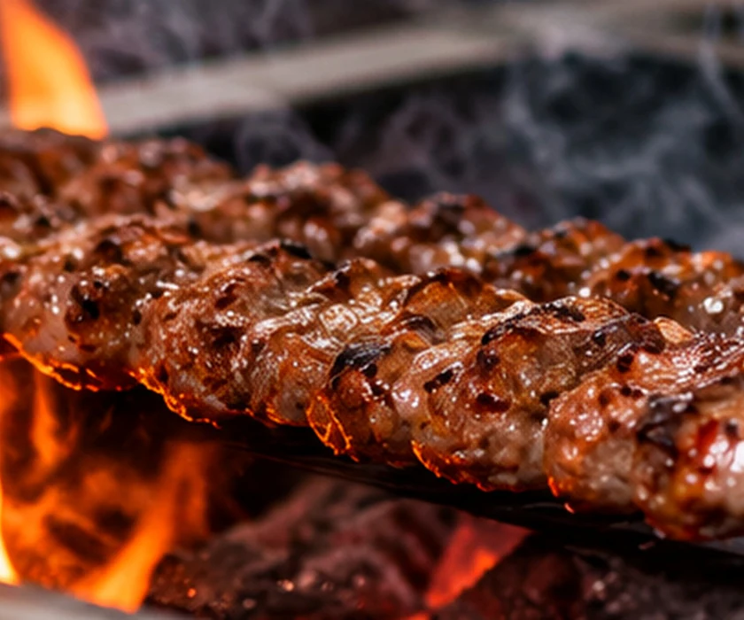 Persian kebabs cooking over charcoal